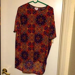 A brand new multi colored top. Shorter in the front and longer in the back.